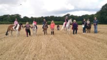 People trekking on horse riding at Willow Farm Riding School in Great Yarmouth