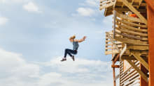 Girl jumping off platform at Hangloose Adventures in Bodelva