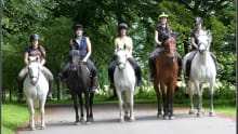 People riding horses at Barbarafield Riding School in Cupar