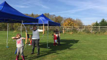 Family doing archery at Apollo Archery in St Albans