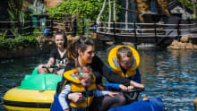 Family on dodgem boat ride at Pirates Cove Adventure Park in Gorey