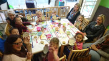 Families making crafts at Pot 2 Doodle Do in Scarborough