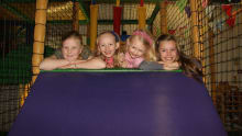 Girls on soft play slide at Jangala in Derby