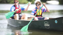 Father and son canoeing at Canoe the Broads in Wroxham