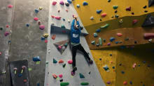 Boy on climbing wall at Durham Climbing Centre