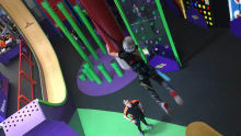 Girl on high rope course at Velocity Trampoline Park Wigan