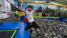 Boy jumping into foam pit at Go Jumpin