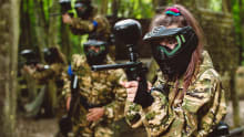 A girl with a paintball gun at GO Paintball in Surrey