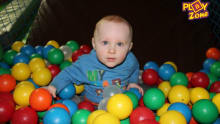 Baby in ball pit at The Custom House Barrow in Furness