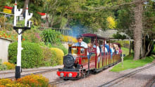 Families on miniature train at Beer Heights Light Railway in Seaton