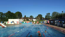 People in outdoor swimming pool at Hampton Pool