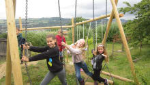 Girls on swings at Bath City Farm