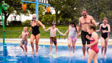 Family on splash pad at Promenade Park in Maldon