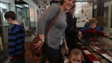 Mum and kids in exhibition room at Bexhill Museum