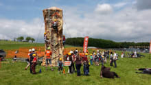 Kids on outside climbing wall at Rock UK Whithaugh Park in Newcastleton