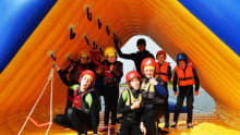 A group of kids playing the watersports activities at Galloway Activity Centre