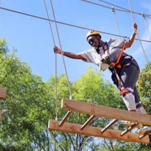 person tackling the high ropes course at Gripped London, Hounslow