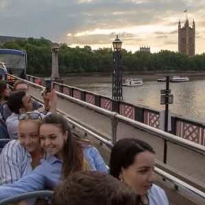 Passengers enjoying illuminated London landmarks on the Taylor Swift Singalong Bus Tour.