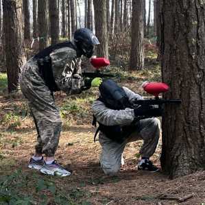 Woodland paintball course with trees and natural cover