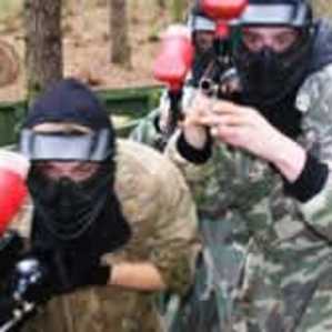 Paintball participants checking in and collecting equipment