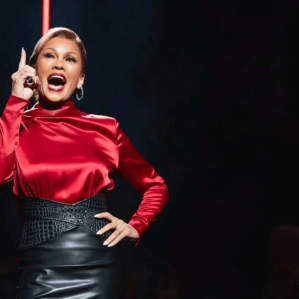 Lead actress performing on stage in a fashion magazine office setting