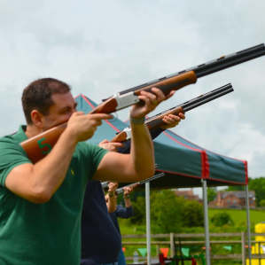 Instructor demonstrating laser shotgun technique to participants