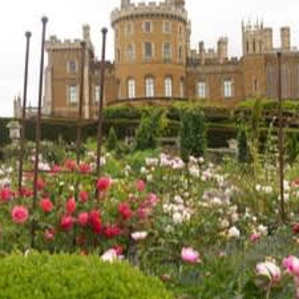 Formal gardens with manicured lawns and mature trees