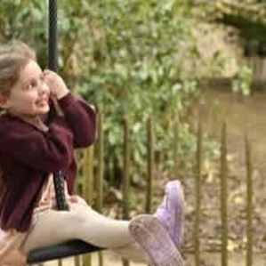 Children playing in an outdoor adventure playground