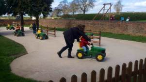 Kids on toy tractor at Wheelock Hall Petting Farm in Sandbach