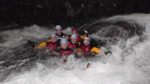 People in white water rapids at Mobile Adventure in Lake District