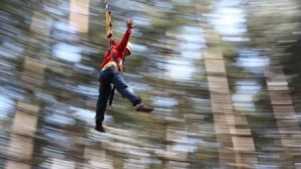 Boy on zip wire at Hilltop Outdoor Centre in Sheringham