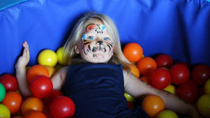 Girl in ball pit at Wild n Wacky in Harlow