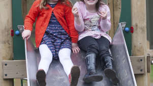 Girls on slide at Worsbrough Mill Museum and Country Park in Barnsley