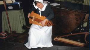 Woman with instrument at Greenfield Valley Heritage Park in Holywell