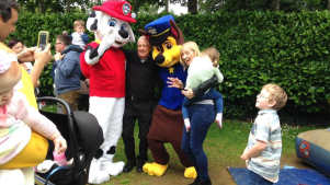Family taking picture with mascots at Fort Evergreen in Warrenpoint