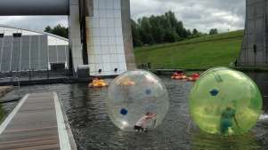 People water zorbing and dodgem boats at Outdoor Trax in Kilsyth