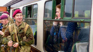 Soldier next to lady in carriage at Telford Steam Railway
