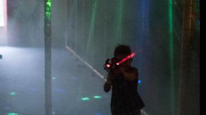 Boy playing laser tag at Play Planet Soft Playcentre in Hereford