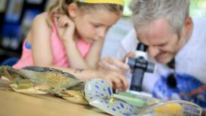 Dad and daughter explore sea creatures at The Living Seas Centre in Flamborough