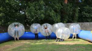 Kids in BodyZorbs play Bubble Football at Live For Today Adventures Kendal