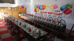 The birthday room at Jolly Jumpers Playzone in Somerset. Paper cups, shiny hats and balloons everywhere