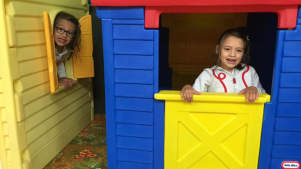 Girls playing in fun house at Springfields Fun Park and Pony Centre in Newquay