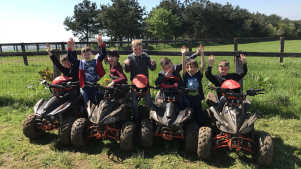 Kids on quadbikes at Quadrenalin Quadbiking Centre in Milton Keynes