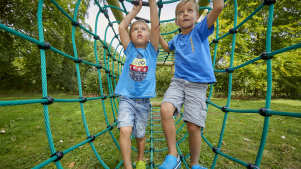 Kids on adventure playground at Sudeley Castle in Winchcombe