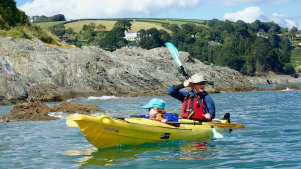 Family kayaking at Sea Kayak Devon