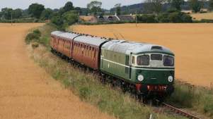 A classic and refurbished train makes its way through the Caledonian Railway