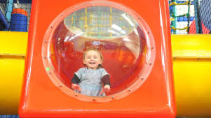 Girl on soft play frame at Rugrats and Half Pints Indoor Play Centre in Banbury