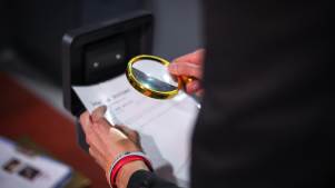 Person looking for clues at Escape The Vault 
