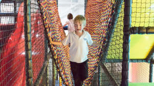 Boy on soft play bridge at Indoor Active in Roche