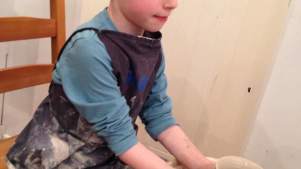 Boy doing pottery at Crafty Owls Pottery Cafe and Art Studio in Wakefield